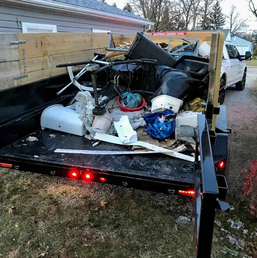 Roll-off dumpster delivered to a residential driveway in Phenix City